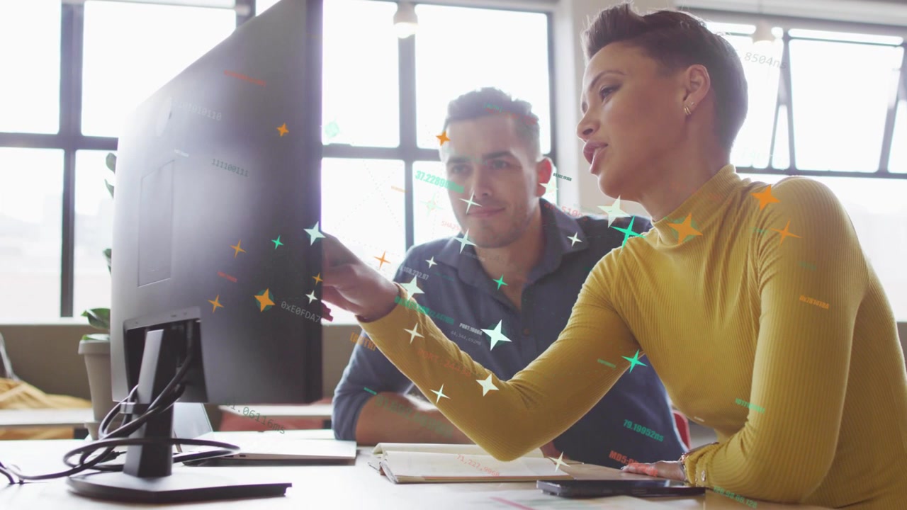 Woman pointing at monitor, man watching, HUD stars aligning with gestures during business review
