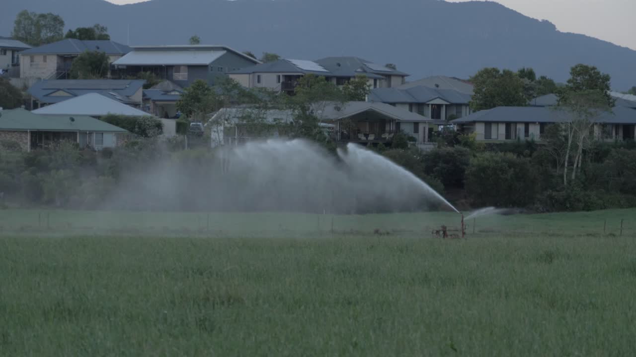 Farm Sprinkler Equipment In Wollumbin National Park - Closed Due To Coronavirus Pandemic - Mount Warning In Tweed Range, NSW, Australia - slow motion