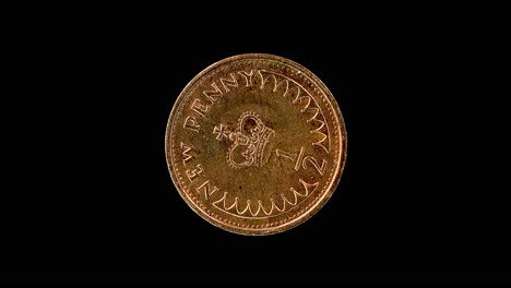 united kingdom 1979 half penny coin reverse with st. edward’s crown rotating on black background