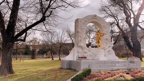 golden statue of johann strauss playing violin in stadtpark vienna austria