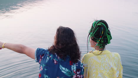 couple enjoying lake view and talking on pier