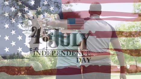 Independence-day-text-banner-against-rear-view-of-african-american-walking-together-in-the-garden