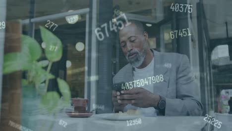 Animation-of-changing-numbers-over-senior-african-american-man-using-phone-in-cafes