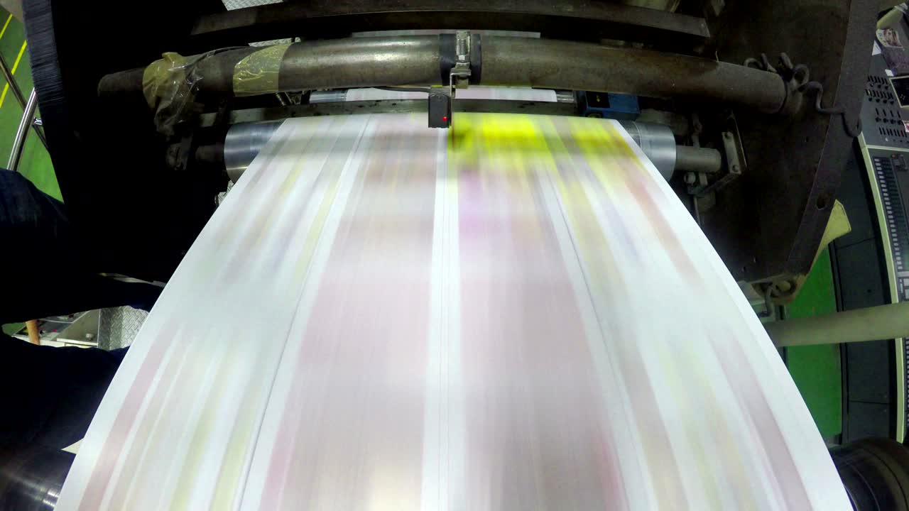 print plant factory, magazine line  press rollers into printing units, UHD stock video LOOP