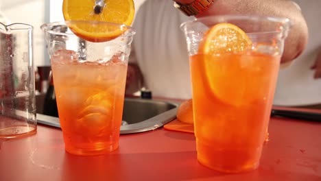 making aperol spritz cocktails