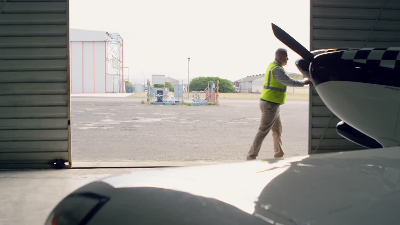 Engineer opening hangar gate 4k