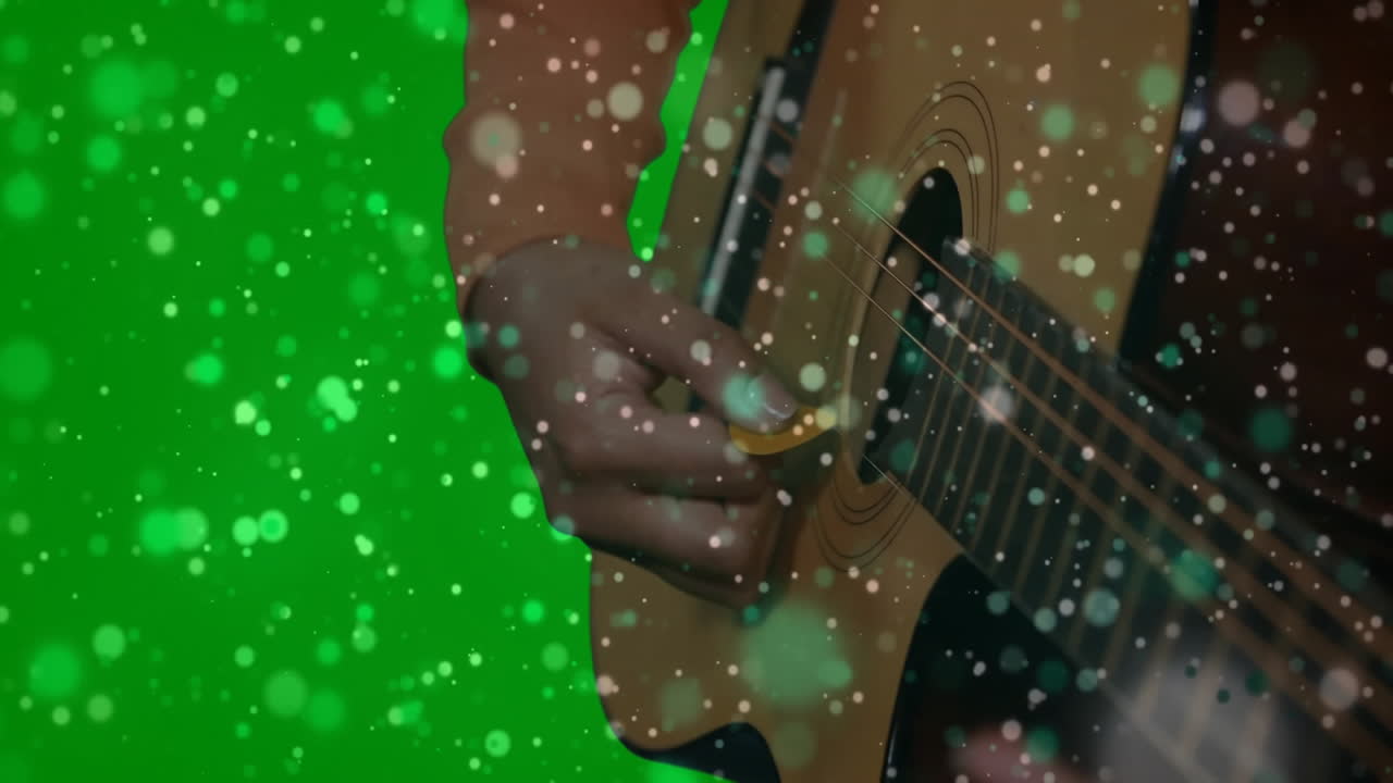 woman strumming acoustic guitar in music education tutorial, displaying floating light particles