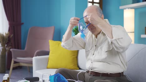 old man wearing respirator and smiling.