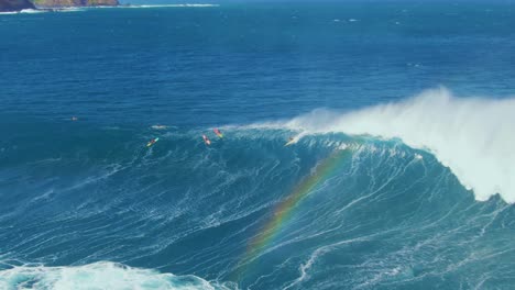 surfers fail to ride big wave coming from deep blue ocean, splashing on rocky coastline of hawaii
