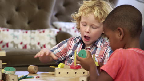 montessori school pupils work at desk with wooden building set