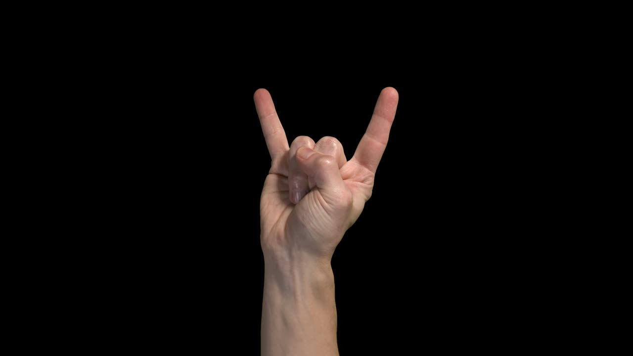 la mano parpadeando el símbolo del rock and roll