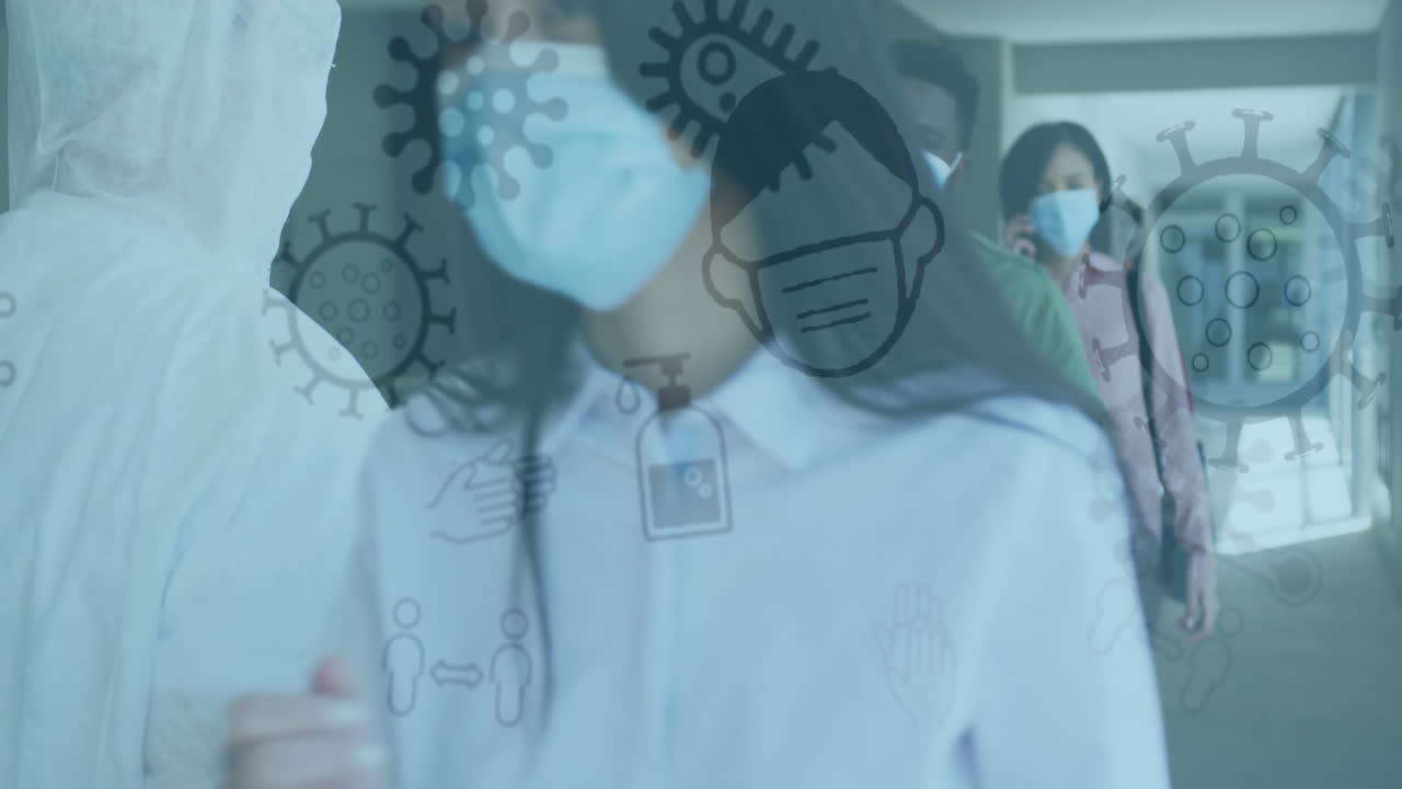 사무실에서 마스크를 착용한 동료들과 함께 떠다니는 코로나19 아이콘의 애니메이션