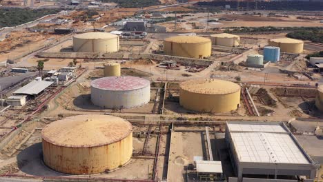 aerial footage over fuel tanks close to power plant