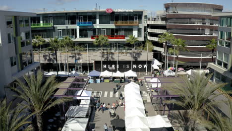 bustling outdoor market in a modern urban setting