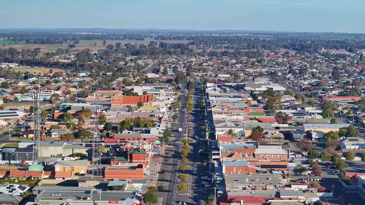 Aerial push forward heading south down the main street of Yarrawonga Victoria Australia