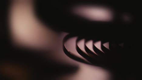 rhythmic clock spring mechanism movement moody abstract macro shot