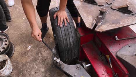 changing a tire at a garage
