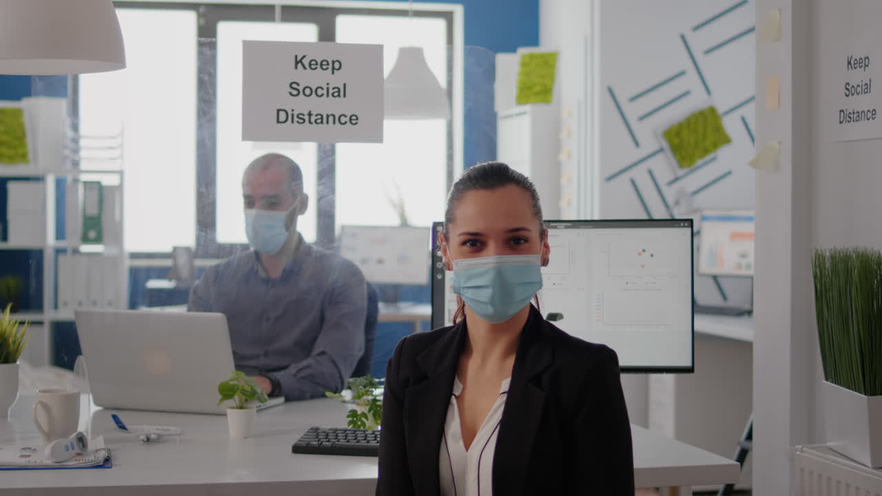 Portrait of woman manager wearing face mask to prevent infection with coronavirus