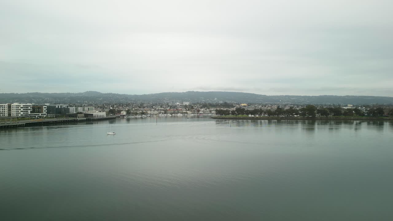 Aerial view of Jack London Square, showcasing its vibrant waterfront, marina, and urban architecture in Oakland, California.