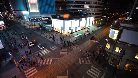 toronto, canada, slow motion - slow motion of dundas square intersection at night