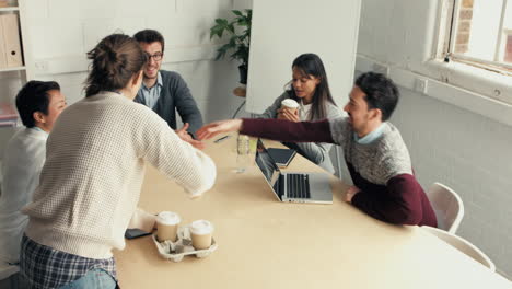 handshake at business meeting showing teamwork