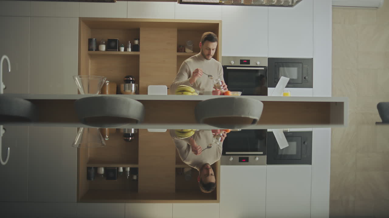 Man Cooking Breakfast in Modern Kitchen