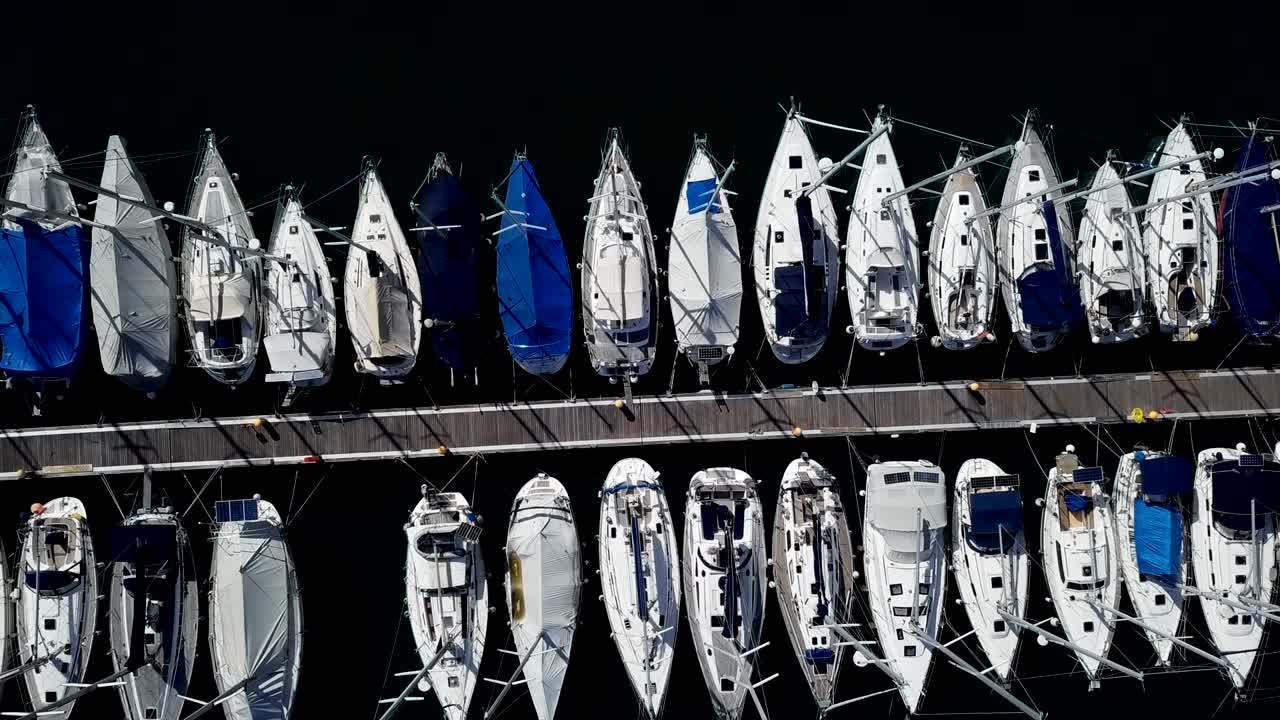 Top down flight over docked boats and small yachts, Vrsar, Istria, Croatia.