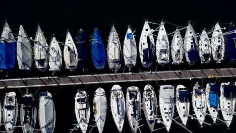 top down flight over docked boats and small yachts, vrsar, istria, croatia.