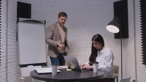 man and woman having a business meeting in boardroom 3