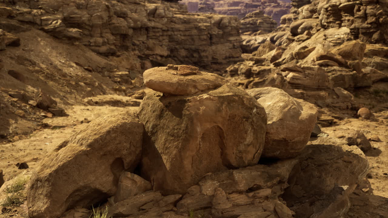 Rock formations in a desert canyon surrounded by rugged landscapes