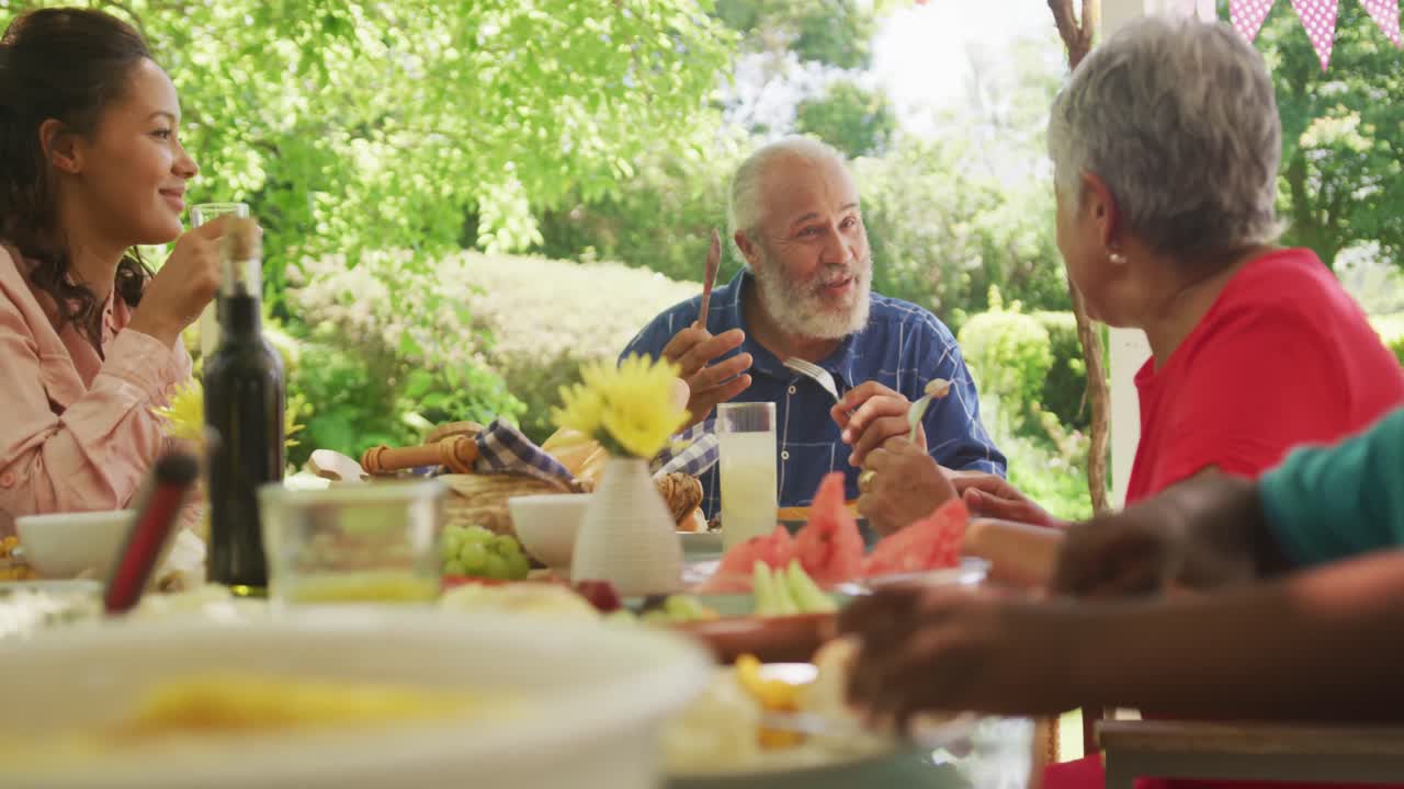 Multi-generation African American family spending time in garden
