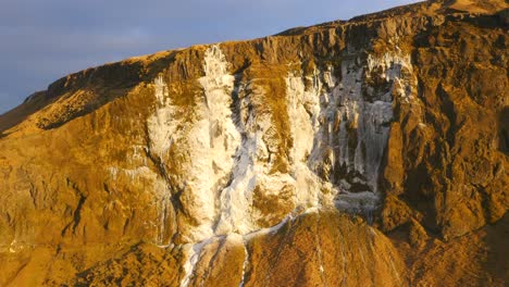 aerial view of beautiful scenery with frozen waterfall in iceland