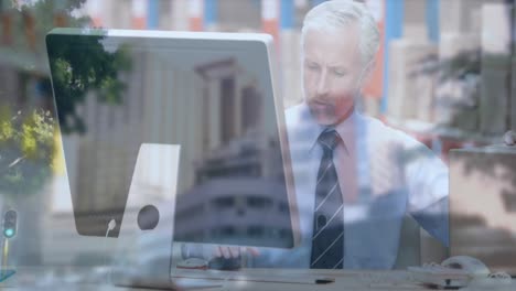 animation of street over businessman using computer next to boxes in shipping centre