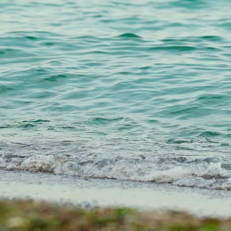 sea waves on black sand beach. slow motion