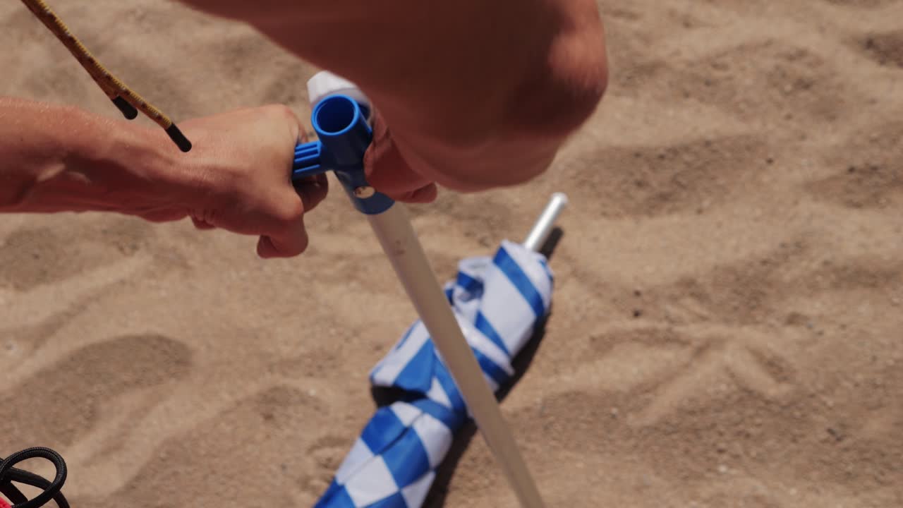 Setting up a beach umbrella