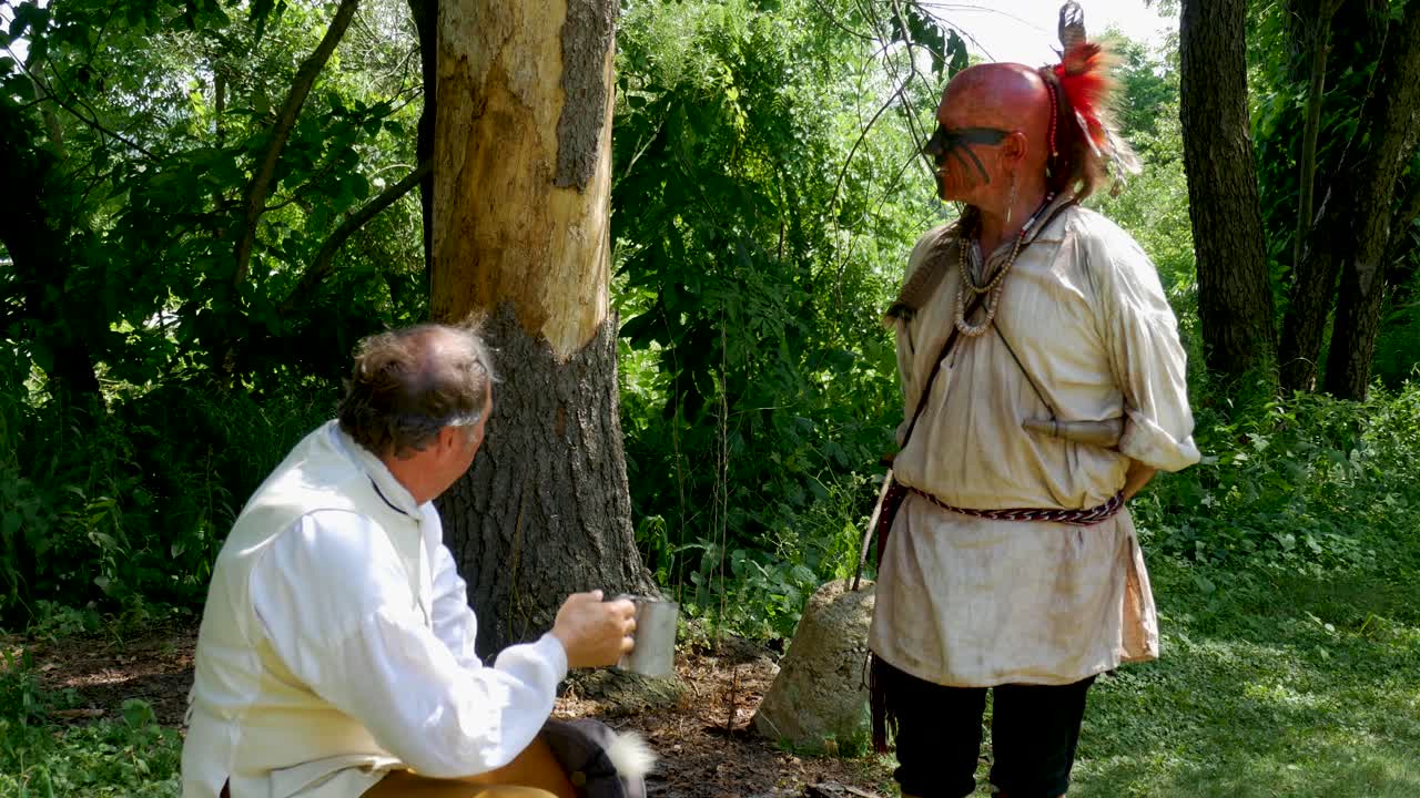 Reenactor Delaware Tribe - Lanape at settlement - talks to settler