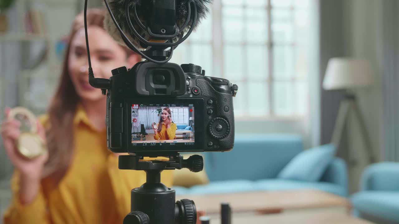 Display Of Camera Recording Video Blog Tells How To Be Beautiful In Home Studio. Influencer Young Transgender Woman Blogger Talks About Makeup