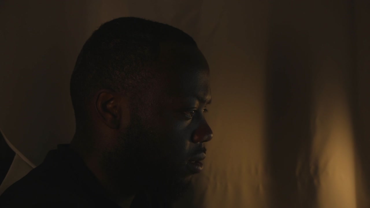 Black Male Working At Home Office Whilst Listening To Music