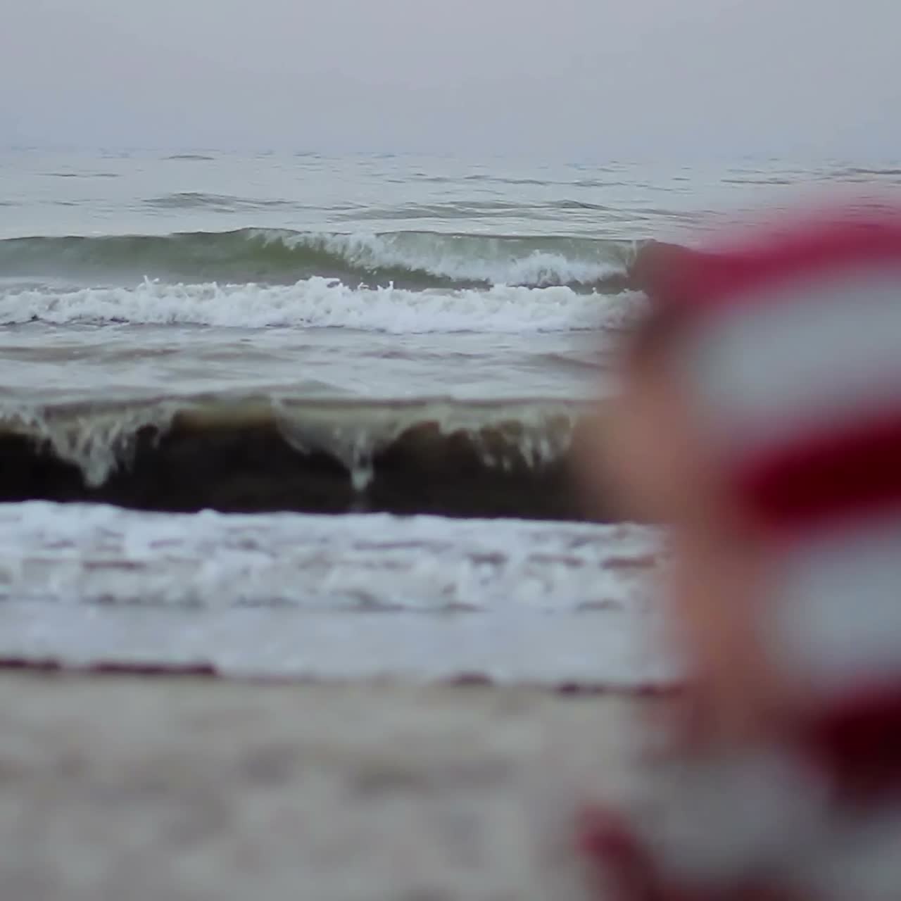 Happy Family Relaxing By The Sea