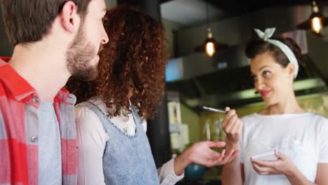 waitress taking order from customers