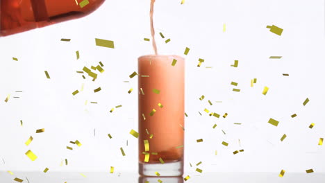 animation of confetti over glass of wine on white background