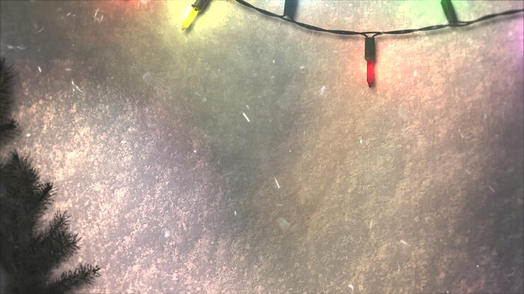 Animated closeup colorful garland and Christmas green tree branches 2
