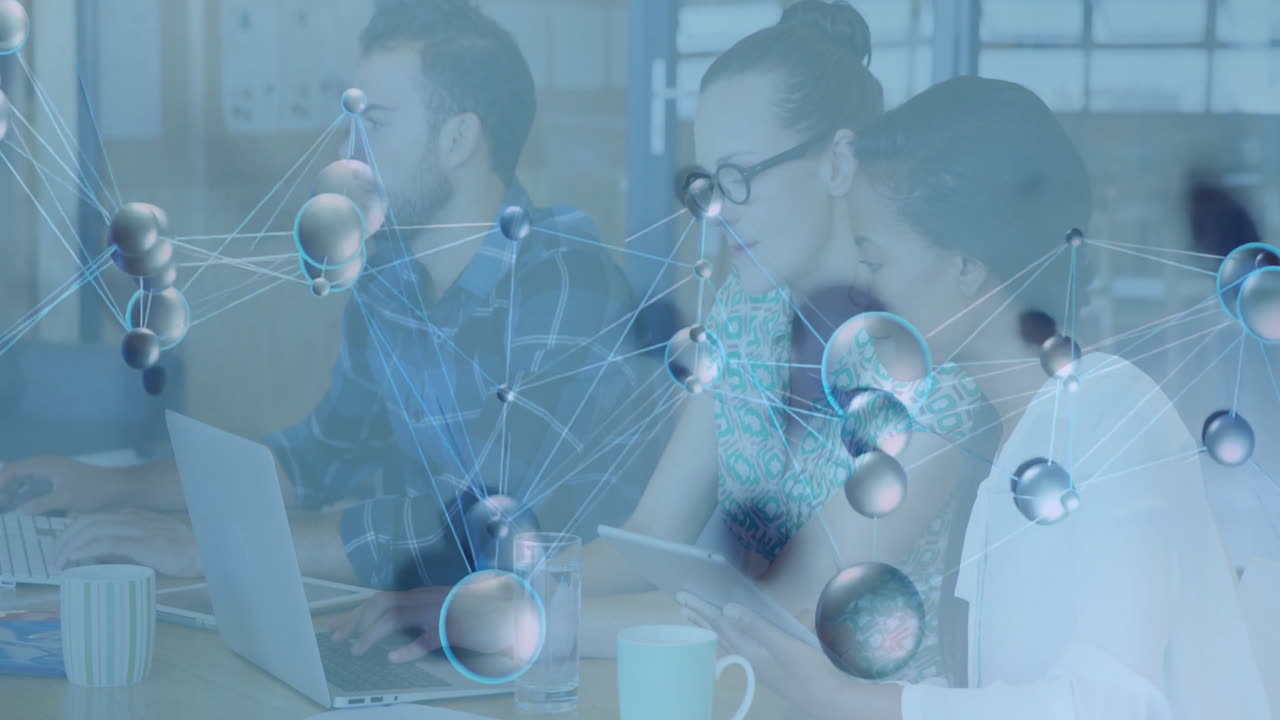 Diverse team working on laptops with molecular structure animation overlay