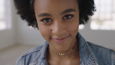 close up portrait of beautiful young black woman smiling looking at camera confident african american female