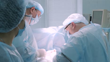 a surgeon in a sterile operating room performing a surgical procedure with focus and precision. represents healthcare, surgery, medical expertise, and patient care