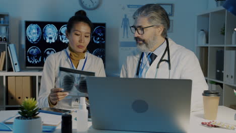 doctors reviewing x-ray images