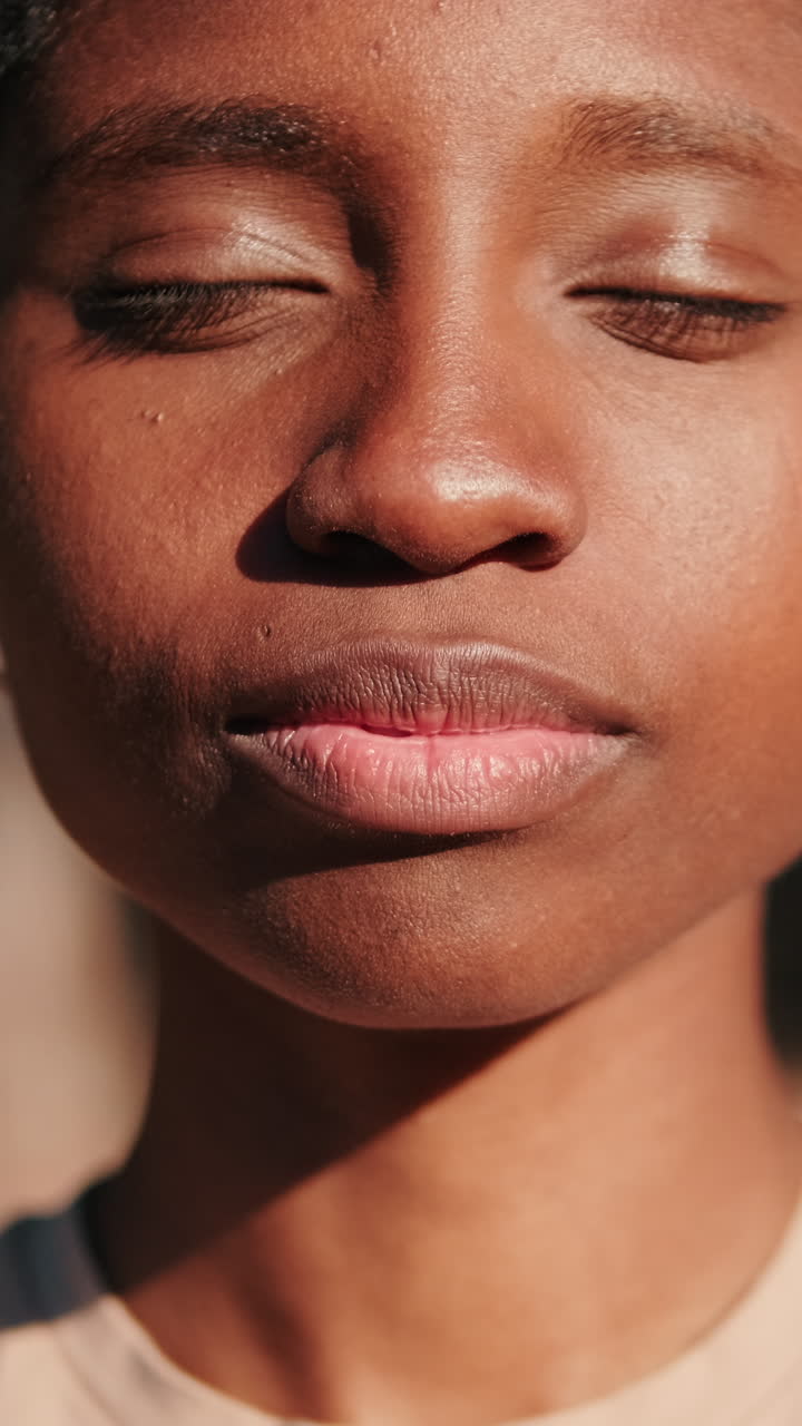 Close-up of Young Black Woman Opening Eyes and Smiling
