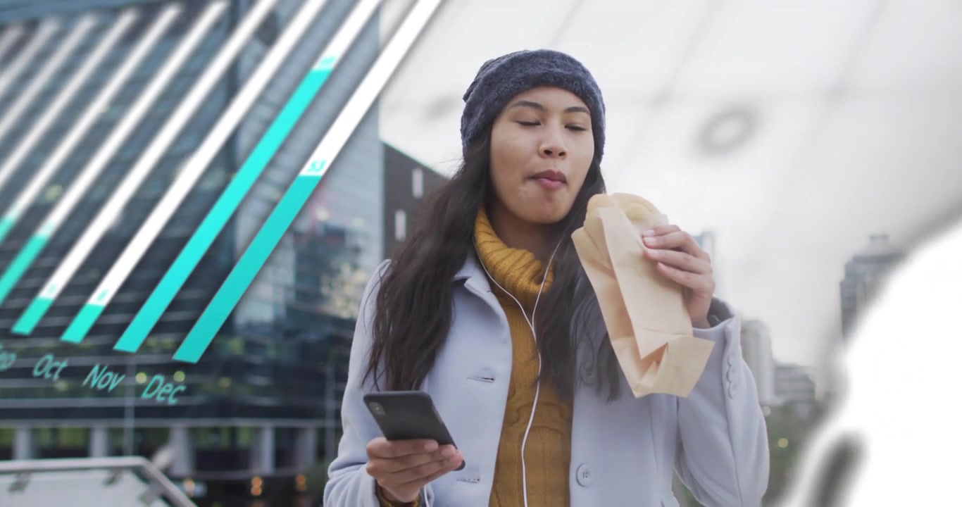 Woman walking waterfront eating pastry tapping smartphone watching tech charts swirling around her