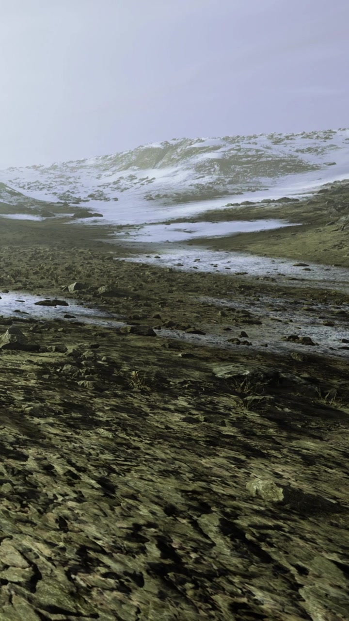 Winter landscape with rocky terrain and snow on the hills