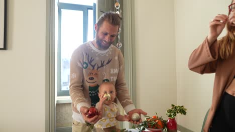 happy family decorating for christmas